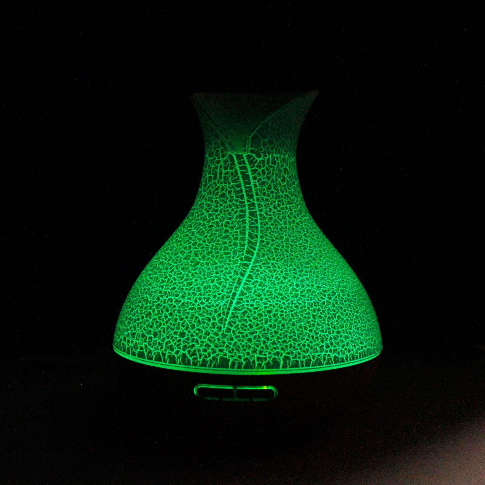 Colour-Changing USB Aroma Diffuser - Palma Shell, crackle-patterned curved design glowing green against black, by Quintessential Holistic Health Ltd