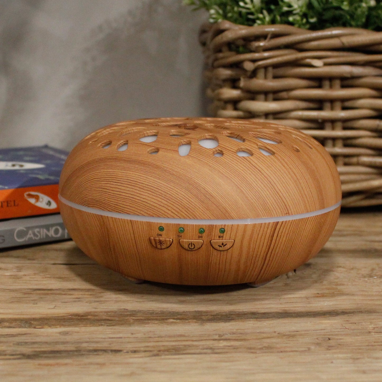 Colour-Changing USB Aroma Diffuser - Oslo Pebble with a wood-effect oval body, leaf-shaped vents and a slim white light band by Quintessential Holistic Health Ltd