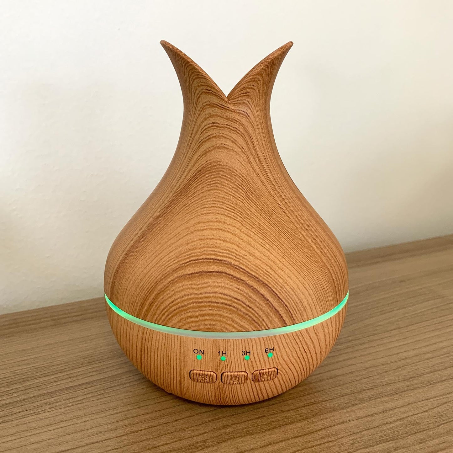Colour-Changing USB Aroma Diffuser - Palermo with a wood-effect teardrop body, curved open top and illuminated green band by Quintessential Holistic Health Ltd