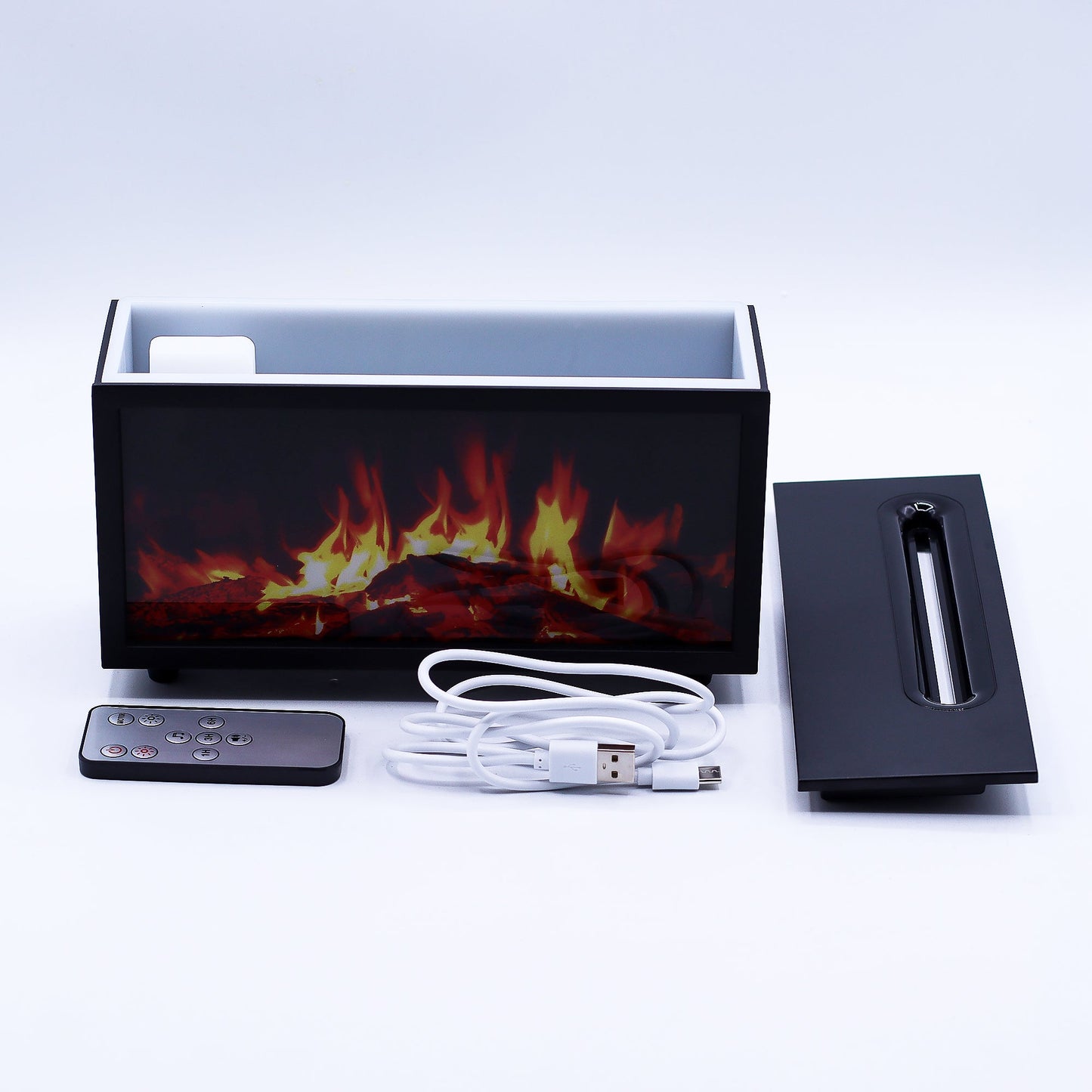 Colour-Change USB Aroma Diffuser – Black Flame Effect & Bird Sound, shown with a remote, white cable and detached top panel by Quintessential Holistic Health Ltd