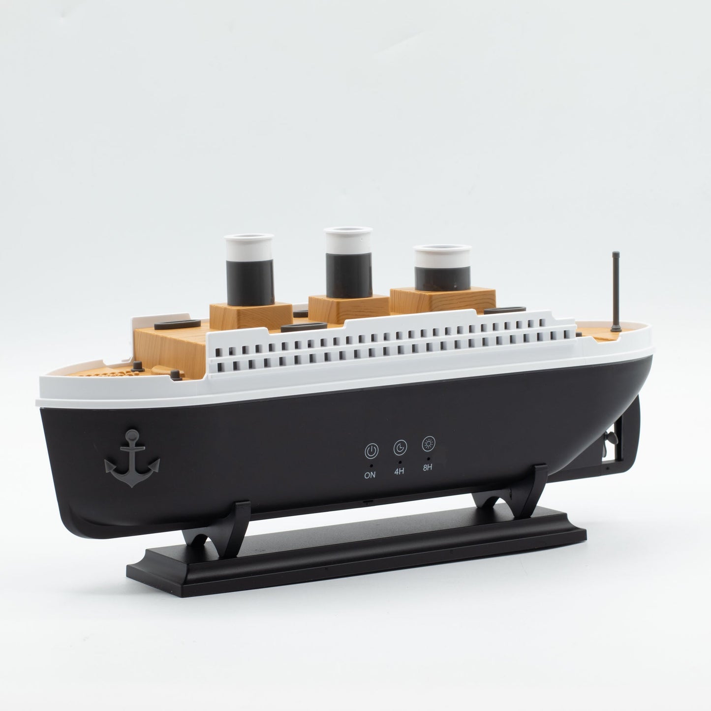 Colour-Changing USB Aroma Diffuser - Ship with Puff Effect, a black ship with three funnels shown diagonally on a rectangular stand, by Quintessential Holistic Health Ltd