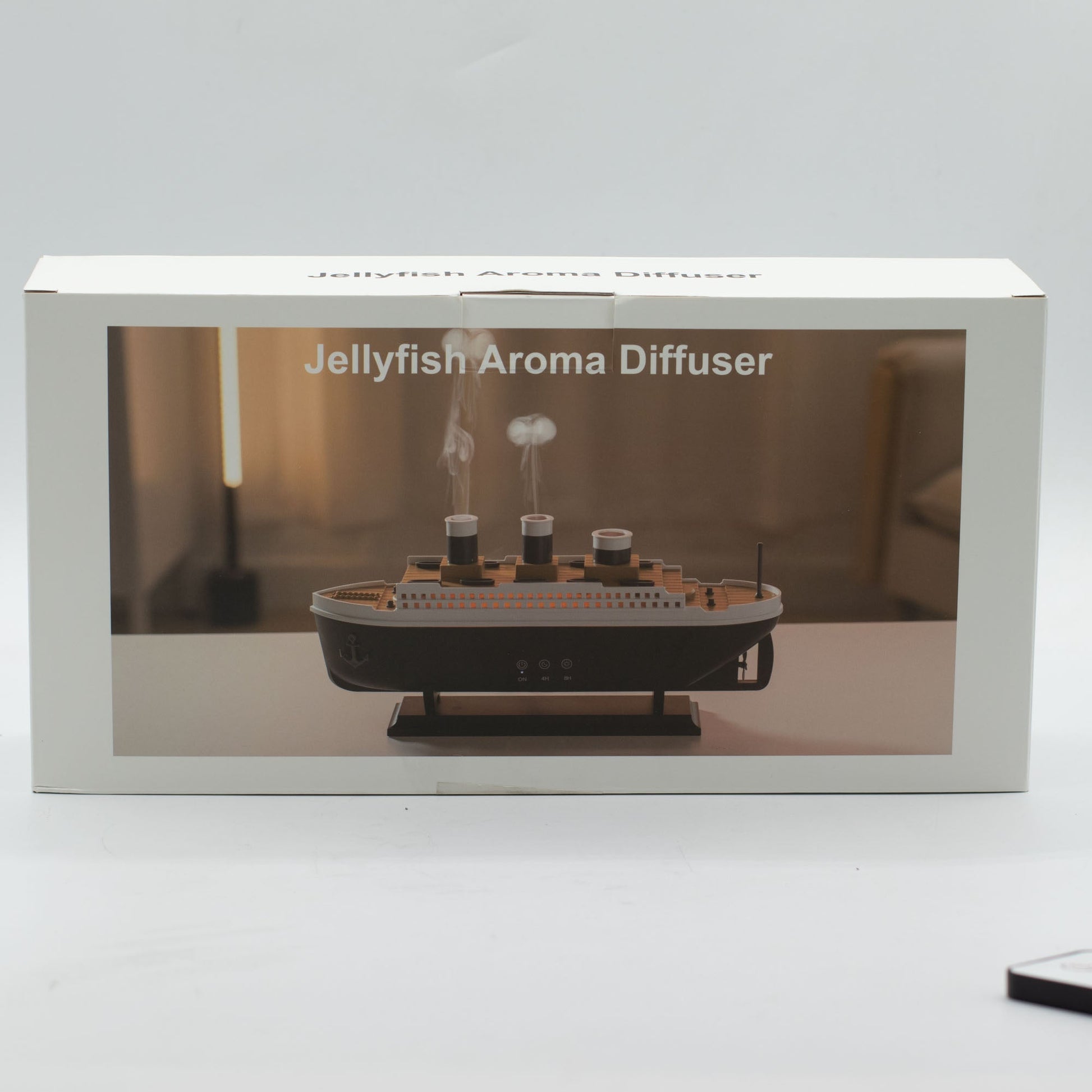 Colour-Changing USB Aroma Diffuser - Ship with Puff Effect, white retail box with a window showing the ship diffuser, by Quintessential Holistic Health Ltd