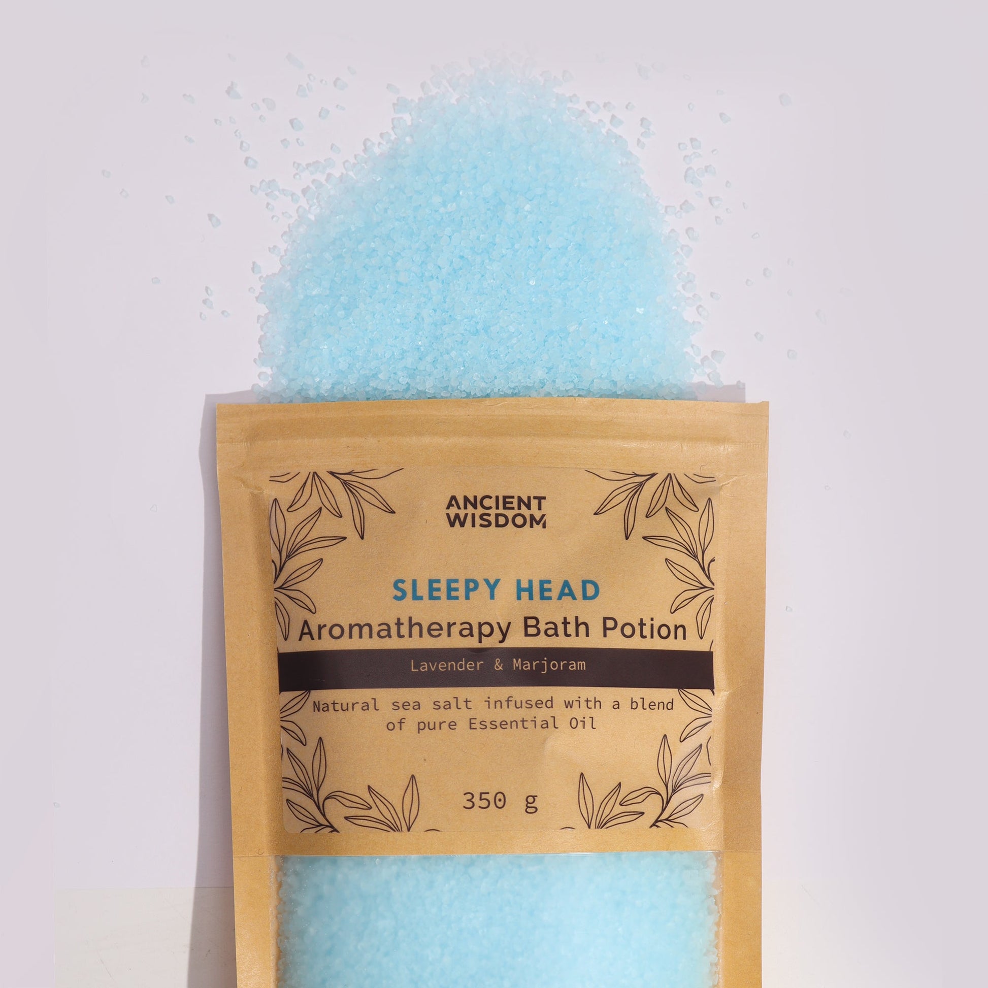 Aromatherapy Bath Potion - Sleepy Head - 350g, open tan pouch with blue granules pictured above it by Quintessential Holistic Health Ltd