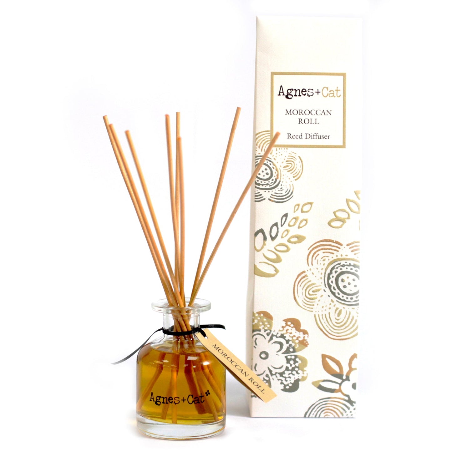 Reed Diffuser - Moroccan Roll - 140ml, amber bottle with natural-coloured reeds and a beige tag beside an illustrated box by Quintessential Holistic Health Ltd