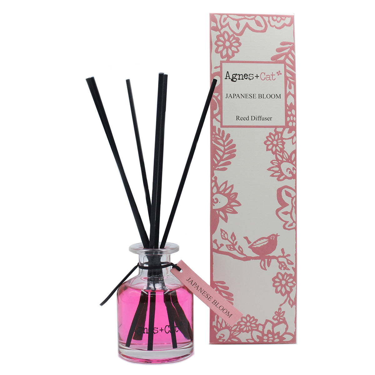 Reed Diffuser - Japanese Bloom - 140ml, bright pink bottle with black reeds beside a pink floral box by Quintessential Holistic Health Ltd