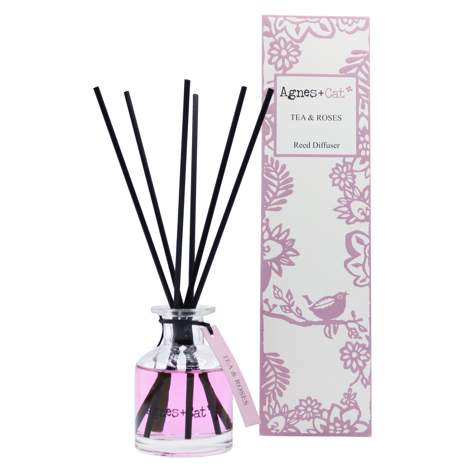 Reed Diffuser - Tea and Roses - 140ml, vivid pink bottle with black reeds beside a pink floral box, by Quintessential Holistic Health Ltd