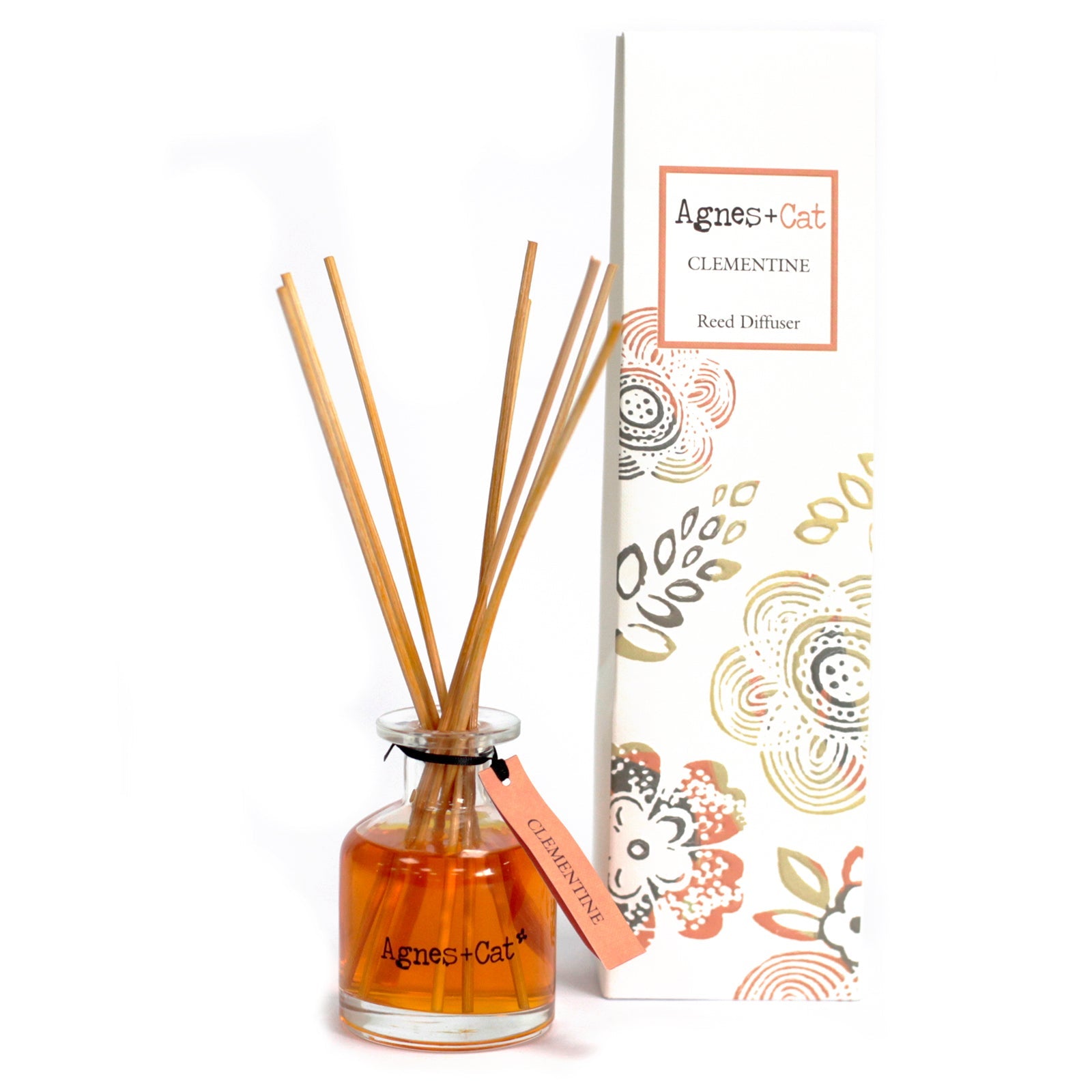 Reed Diffuser - Clementine - 140ml, amber bottle with natural-coloured reeds beside a patterned box by Quintessential Holistic Health Ltd