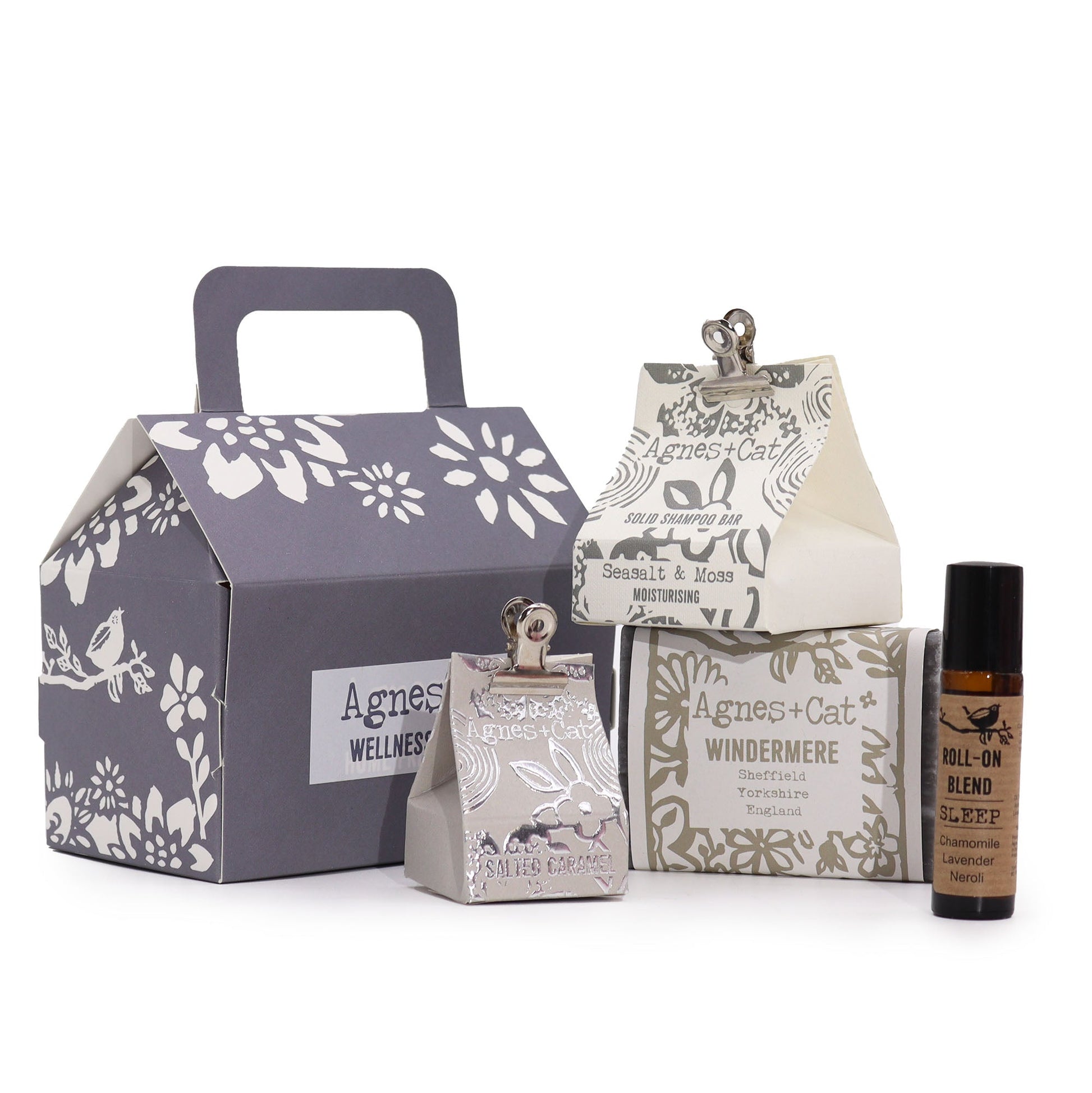 Handmade Personal Wellness Gift Set - Lake Breeze, grey floral box displayed with three patterned cartons and a small dark bottle, by Quintessential Holistic Health Ltd