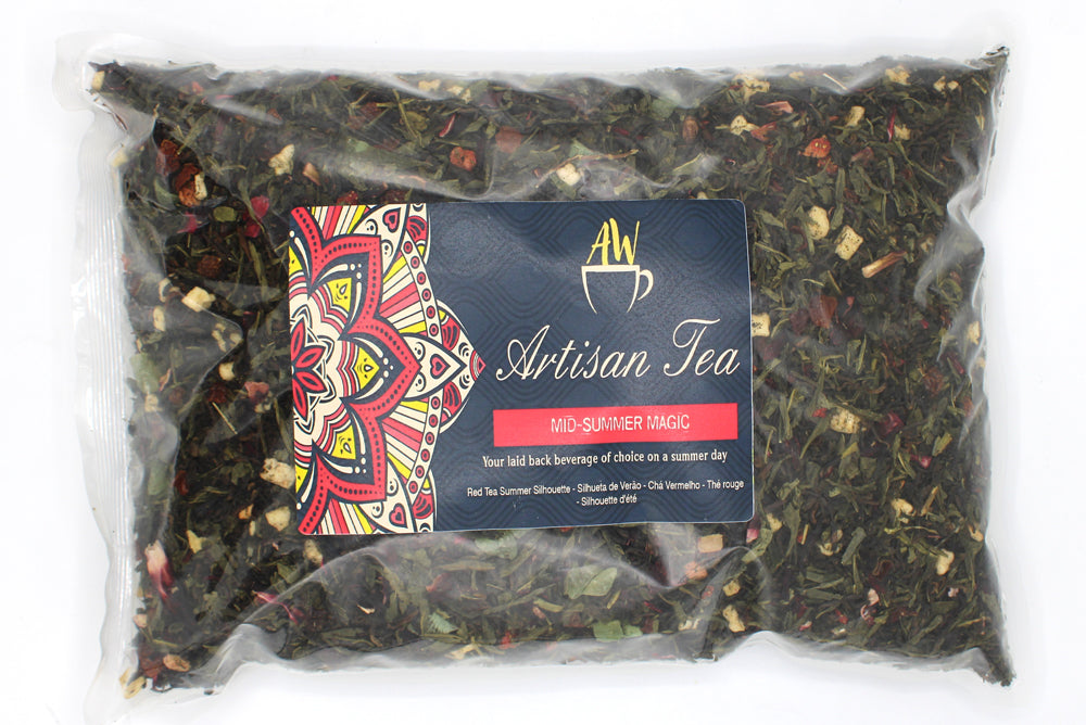 In a clear sealed bag with a colourful Artisan Tea label; Mid-Summer Magic green tea blend from Quintessential Holistic Health.