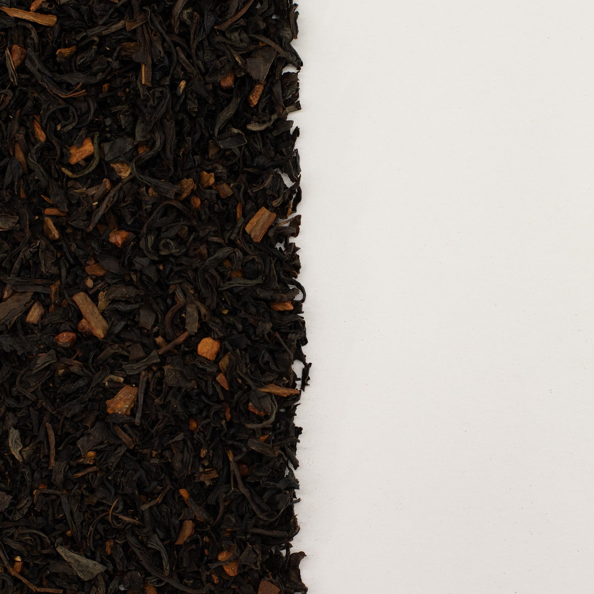 50g Organic Cinnamon Black Blend Artisan Tea product packaging on clean background from Quintessential Holistic Health Ltd