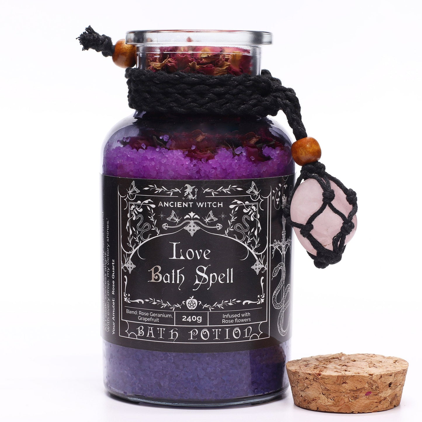 Vegan Bath Spell Potion & Rose Quartz Crystal Amulet - Love, purple bottle with pink charm and its cork placed beside it by Quintessential Holistic Health Ltd