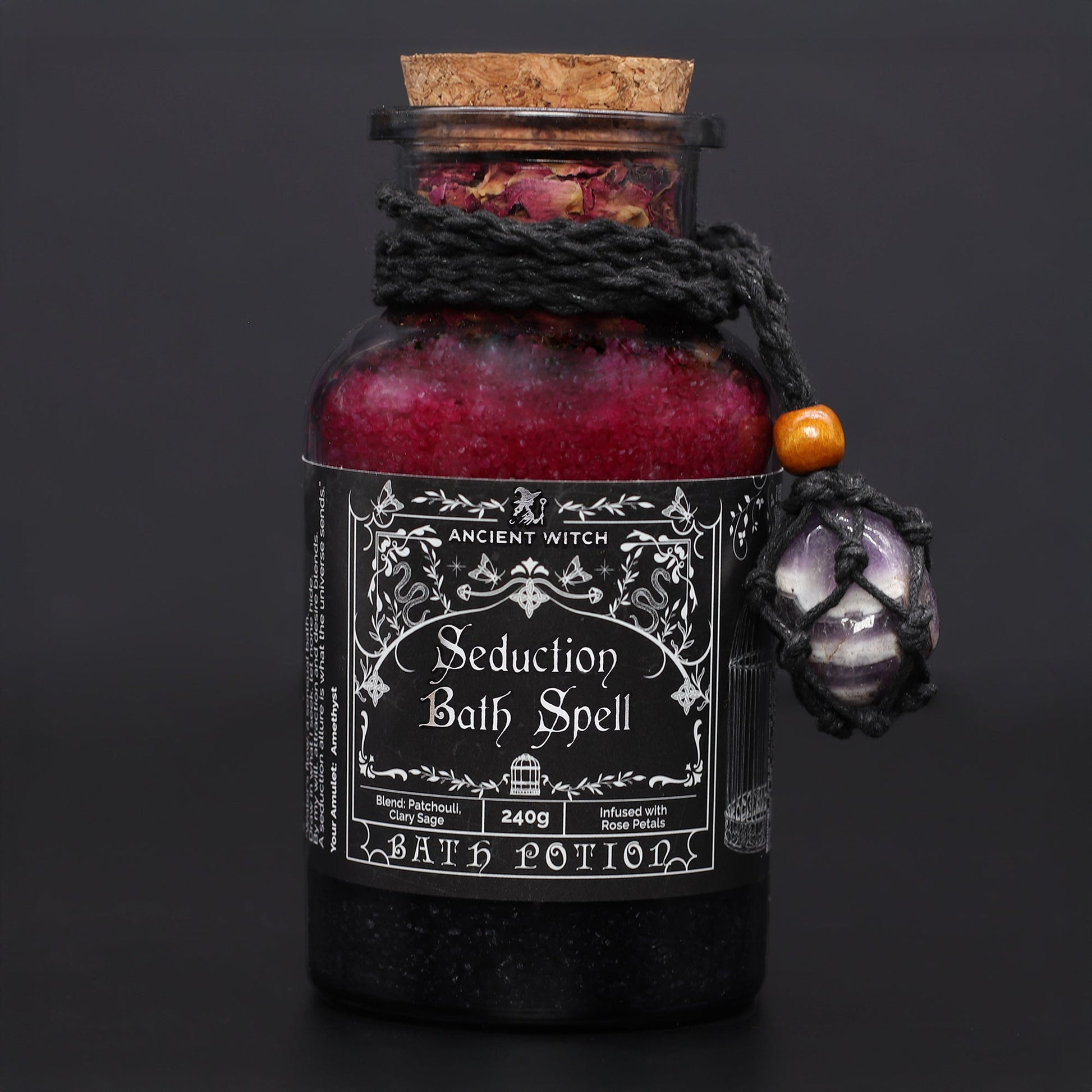 Vegan Bath Spell Potion & Amethyst Crystal Amulet - Seduction, corked red and black bottle with a purple stone charm, by Quintessential Holistic Health Ltd