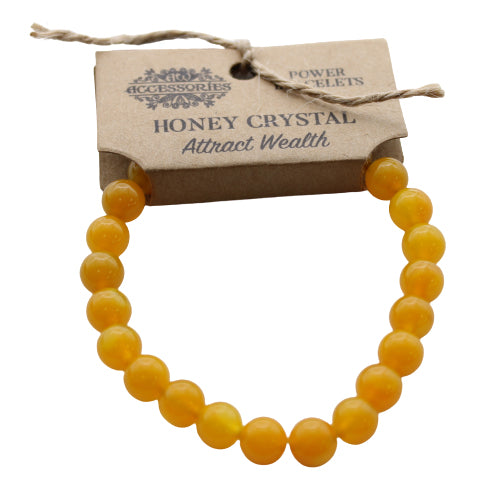 Honey Crystal Gemstone Power Bracelet - 7 × 0.8cm with warm honey-yellow round beads hanging beneath a branded card, by Quintessential Holistic Health Ltd