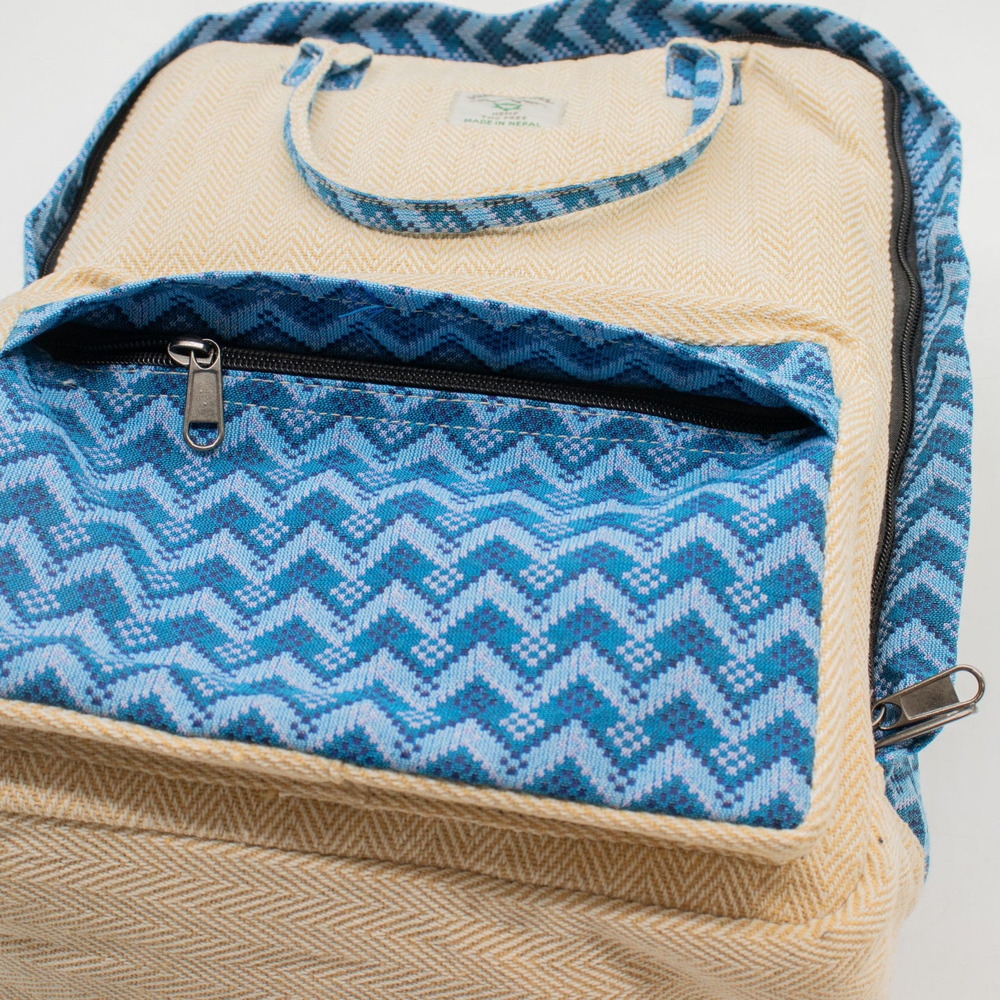 Large Kathmandu hemp backpack with blue Dhaka design, alternate product view 2 from Quintessential Holistic Health.