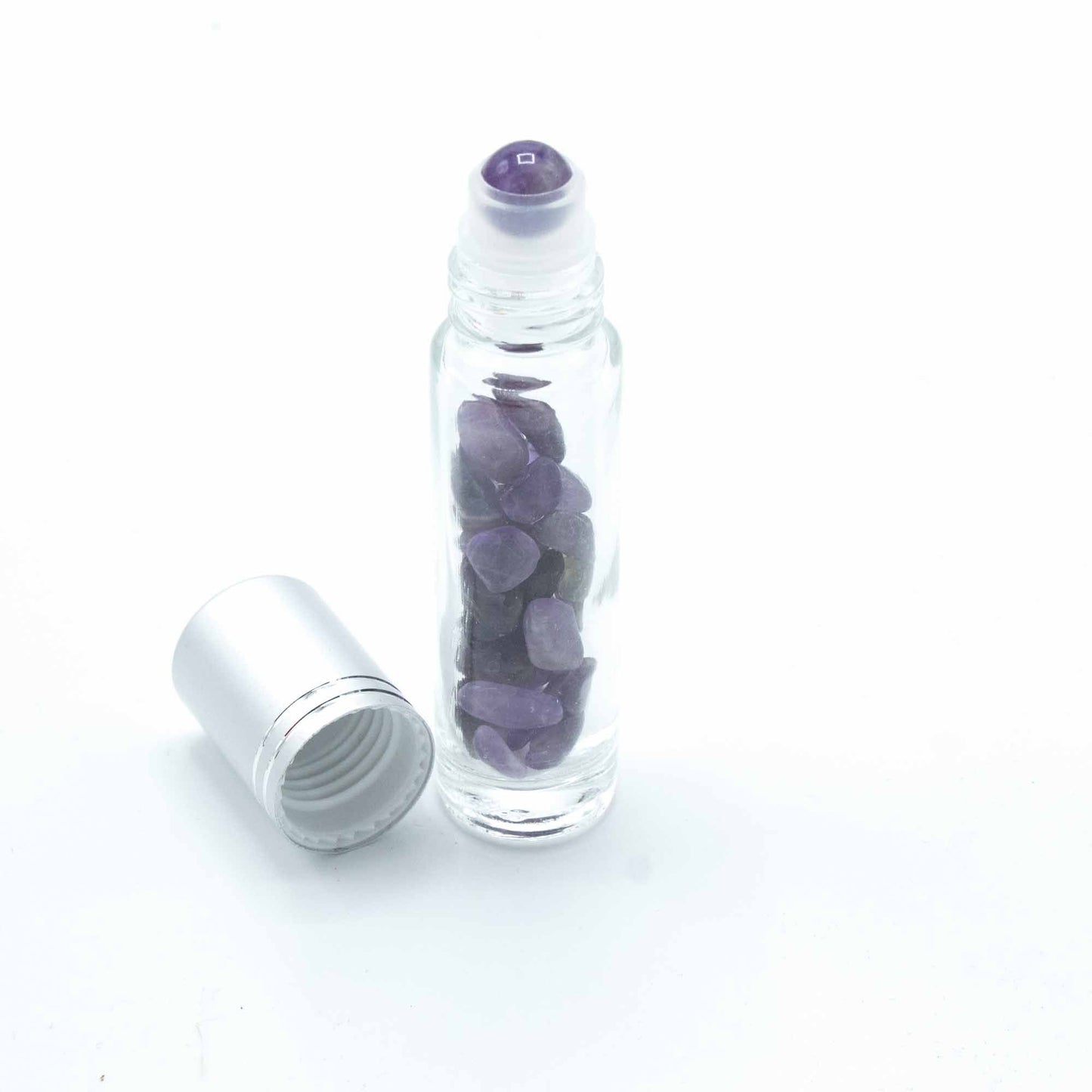 Amethyst 10ml gemstone roller bottle with silver cap and visible stone pieces, secondary detail view from Quintessential Holistic Health.