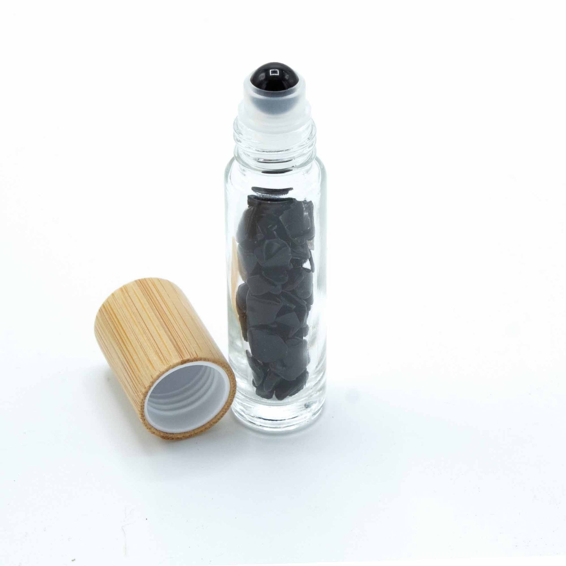 Black Tourmaline 10ml gemstone roller bottle with wooden cap and visible stone pieces, main product view from Quintessential Holistic Health.