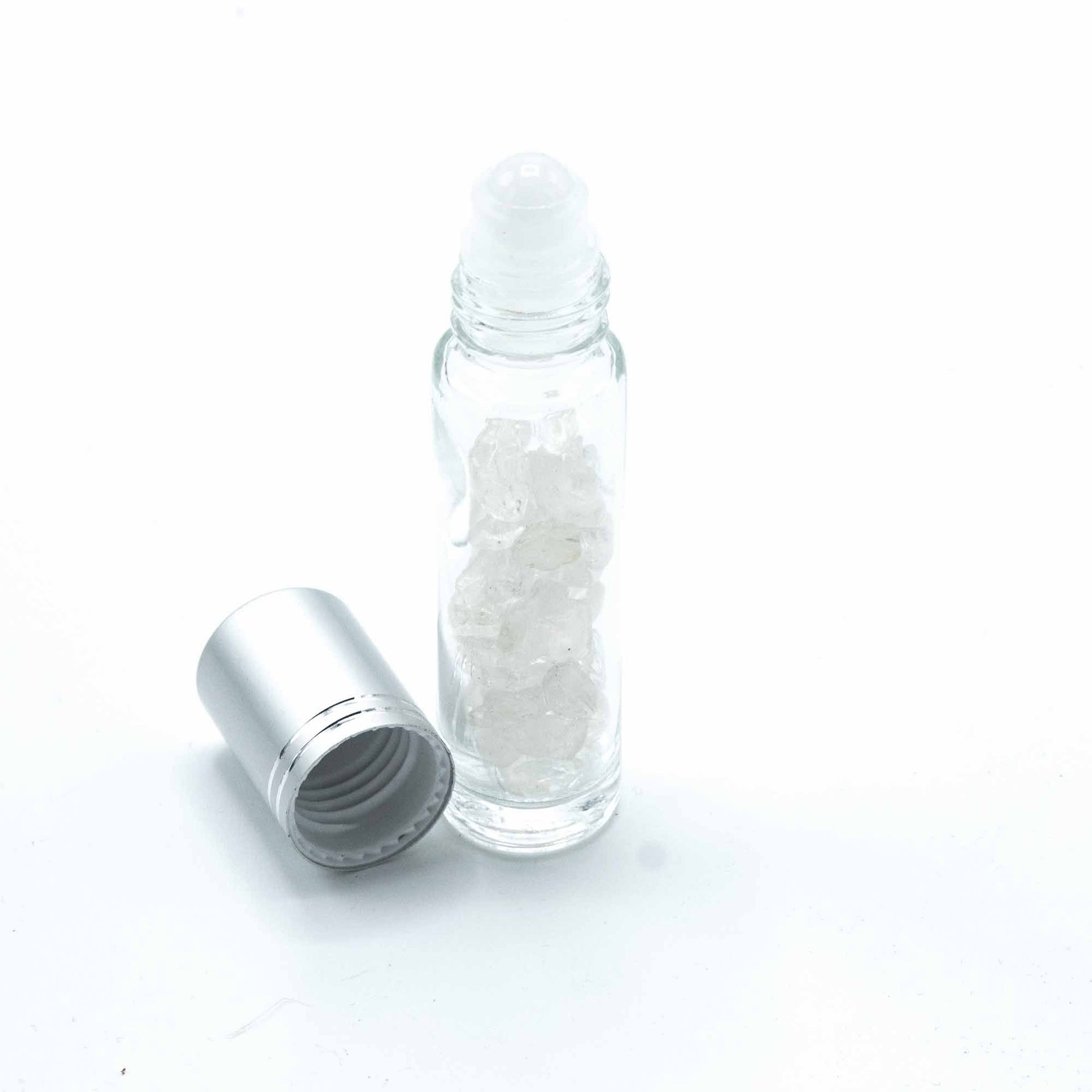 Rock Quartz 10ml gemstone roller bottle with silver cap and visible stone pieces, secondary detail view from Quintessential Holistic Health.