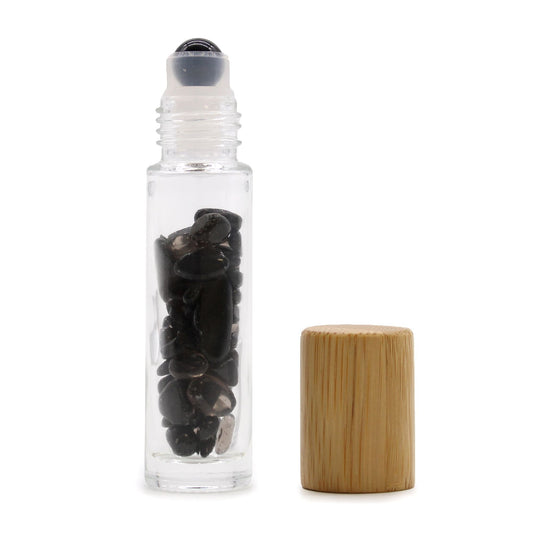 Black Tourmaline 10ml gemstone roller bottle with wooden cap and visible stone pieces, alternate product view from Quintessential Holistic Health.
