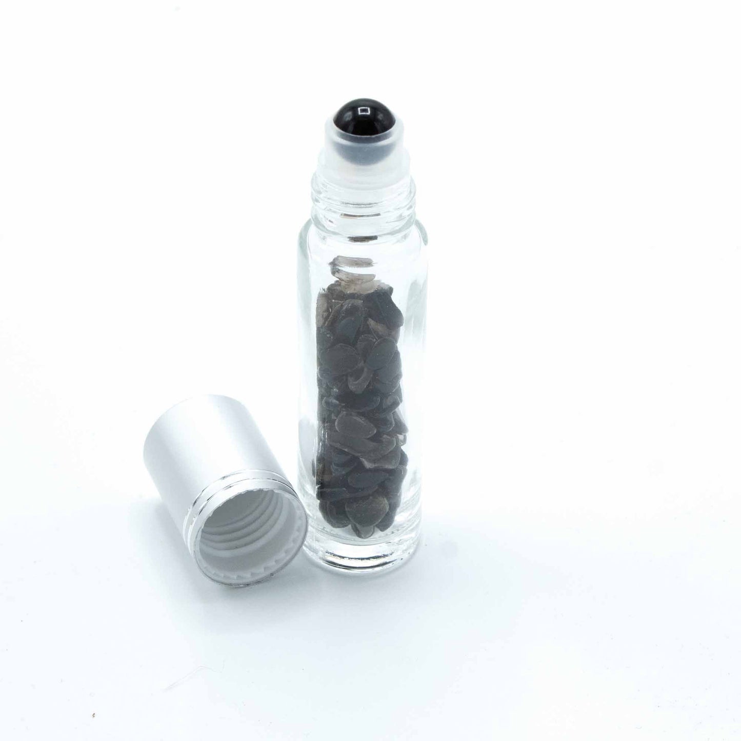 Black Tourmaline 10ml gemstone roller bottle with silver cap and visible stone pieces, product detail view from Quintessential Holistic Health.