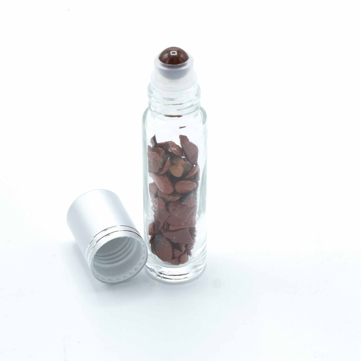 Red Jasper 10ml gemstone roller bottle with silver cap and visible stone pieces, secondary detail view from Quintessential Holistic Health.