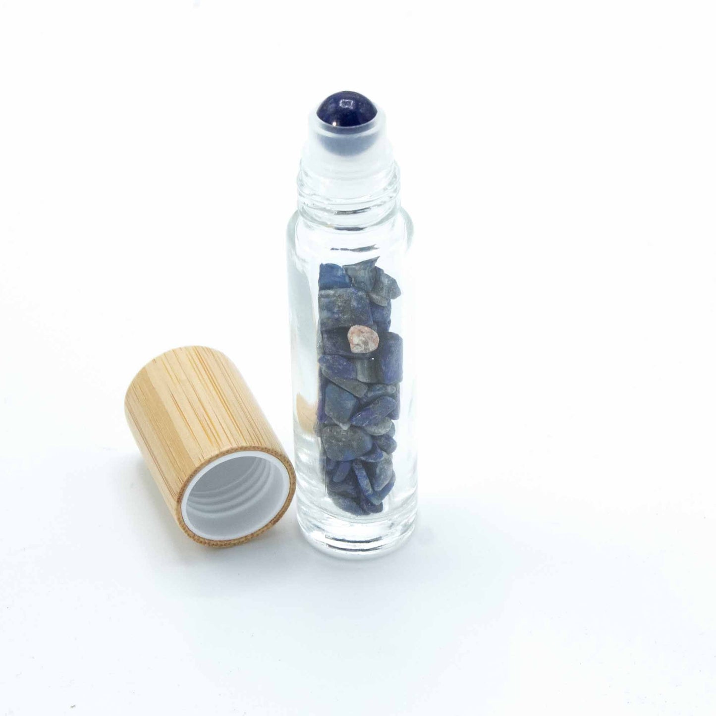 Sodalite 10ml gemstone roller bottle with wooden cap and visible stone pieces, secondary detail view from Quintessential Holistic Health.
