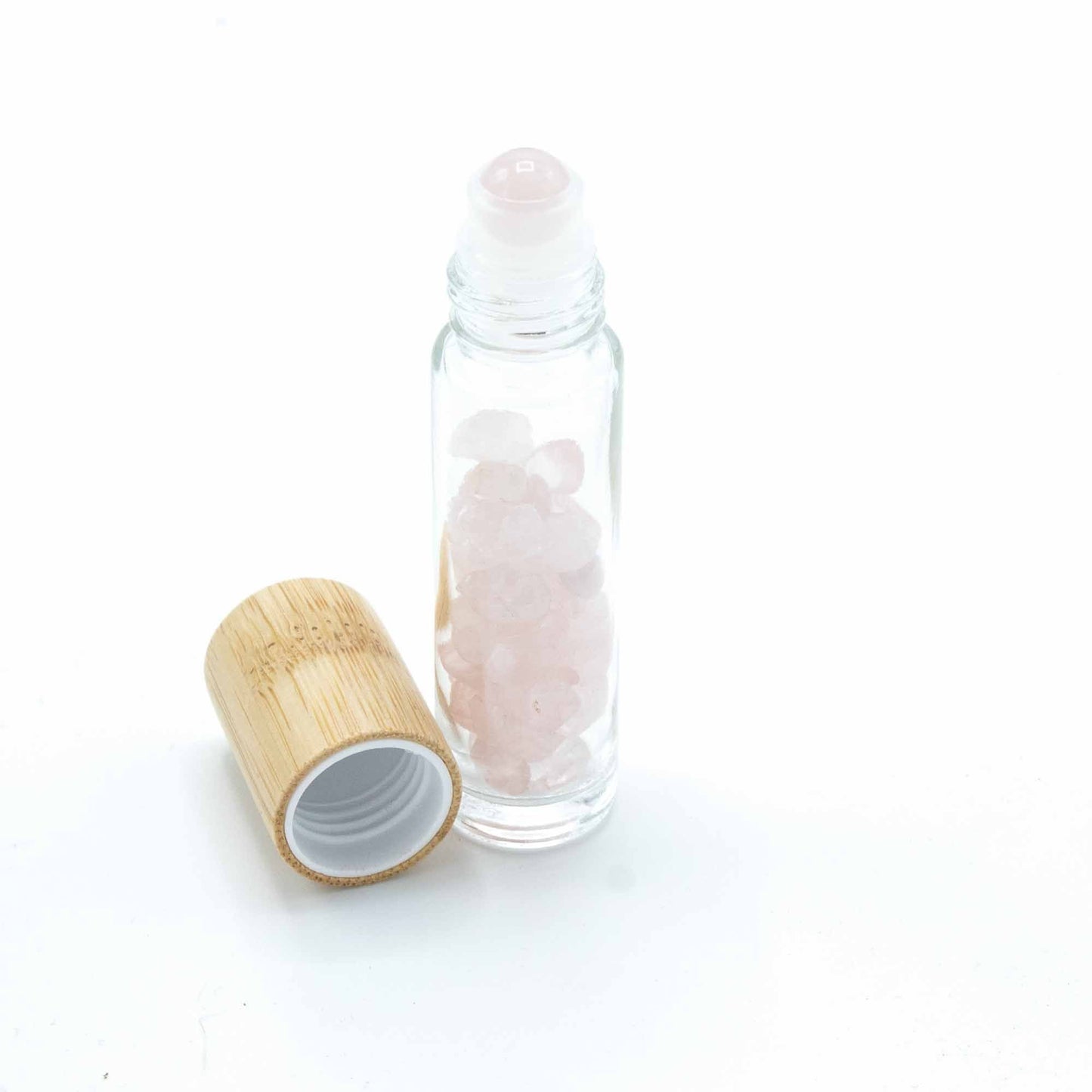 Rose Quartz 10ml gemstone roller bottle with wooden cap and visible stone pieces, secondary detail view from Quintessential Holistic Health.