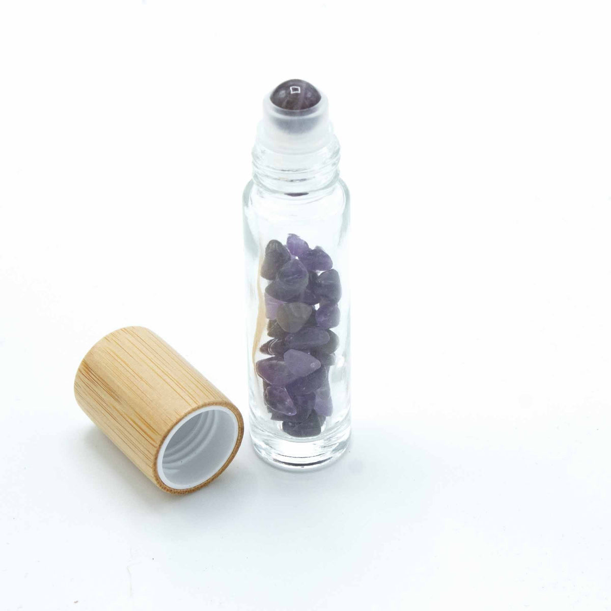 Amethyst 10ml gemstone roller bottle with wooden cap and visible stone pieces, secondary detail view from Quintessential Holistic Health.