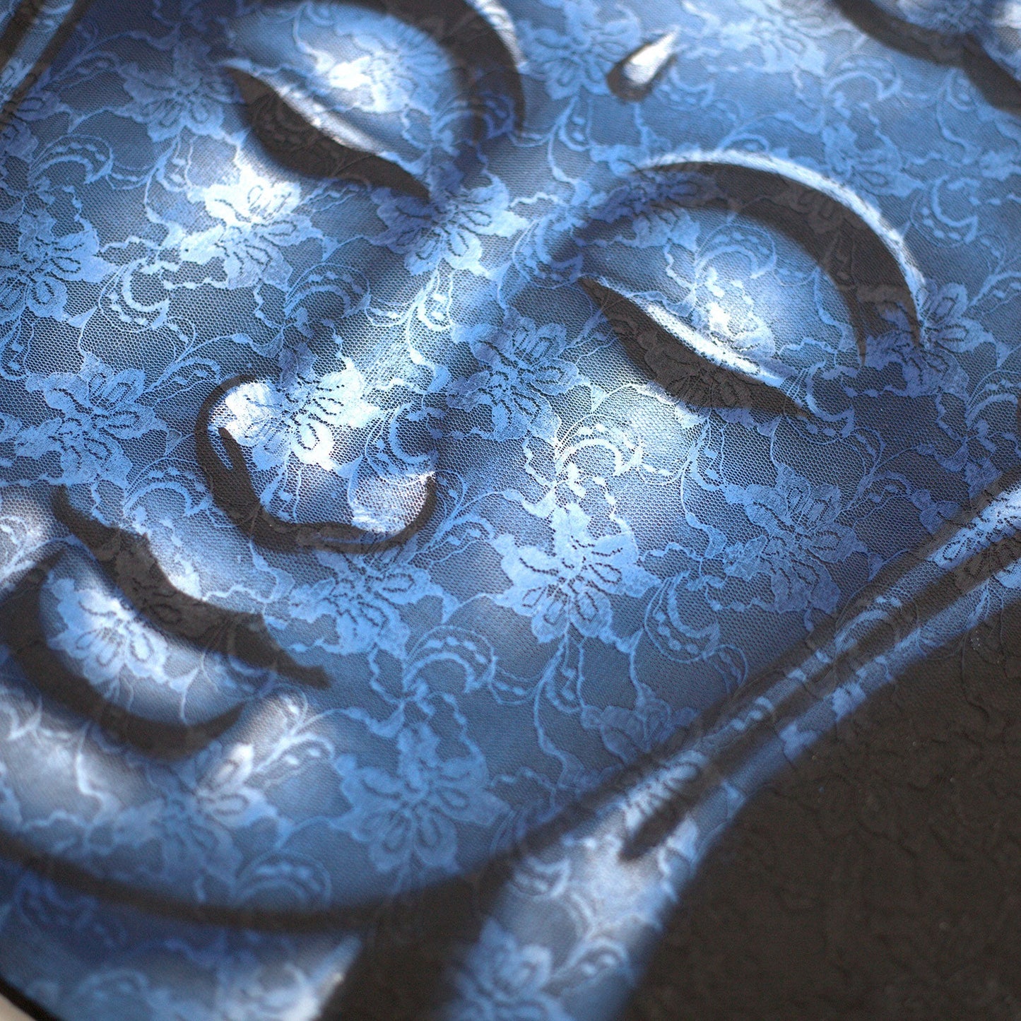 Hand-Painted Buddha Painting - Blue Brocade Detail, angled close view of the blue face and intricate floral texture, by Quintessential Holistic Health Ltd