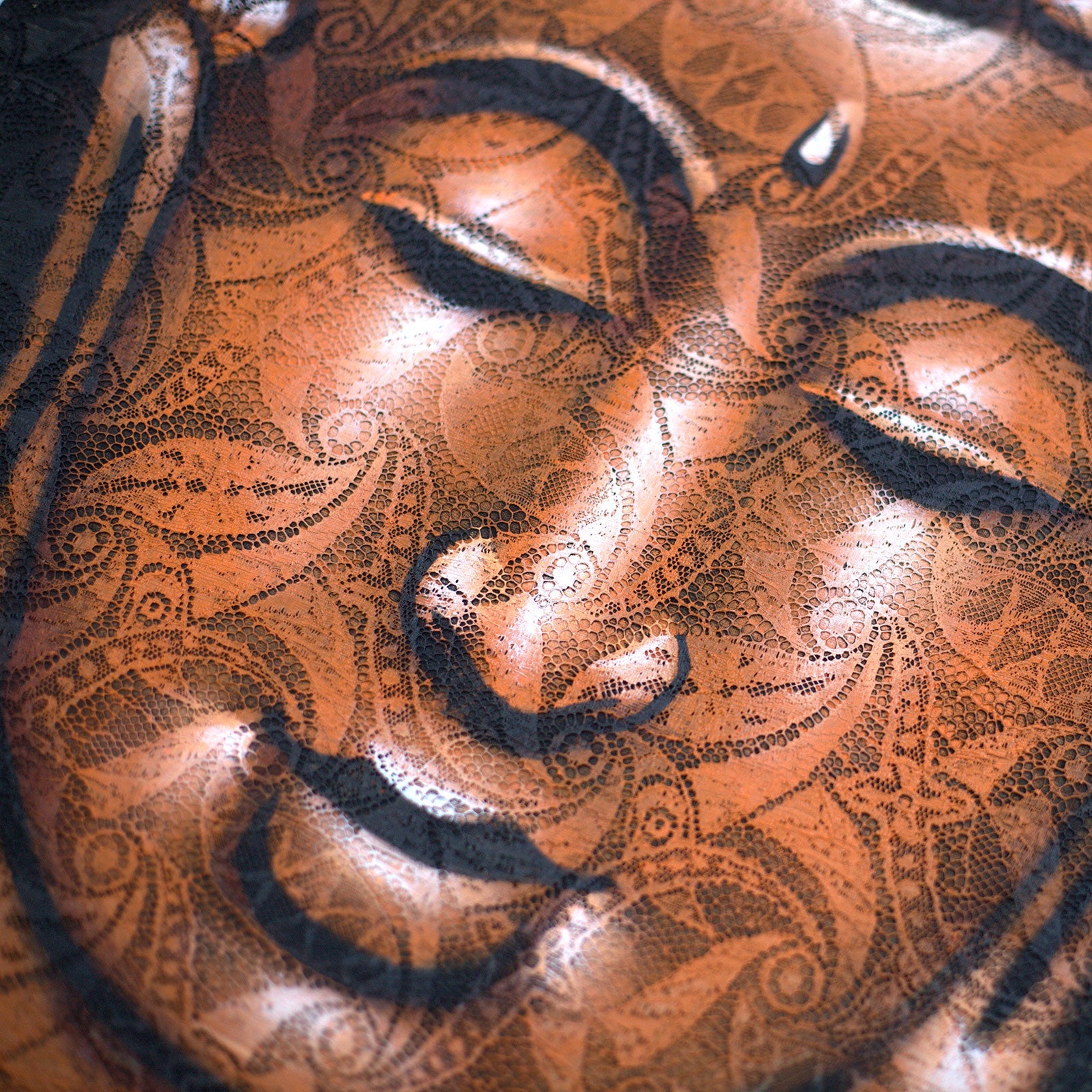 Hand-Painted Buddha Painting - Copper Brocade Detail, close-up of the closed eyes, nose, lips and ornate copper patterning, by Quintessential Holistic Health Ltd