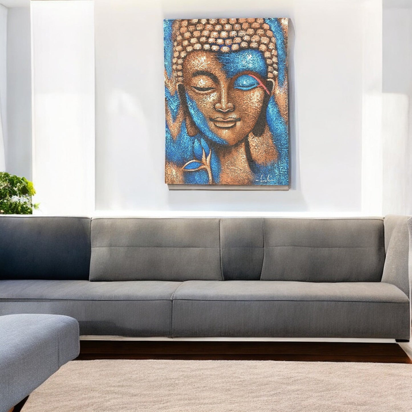 Hand-Painted Buddha Painting - Bronze and Blue Flower, displayed above a grey corner sofa against a white wall, by Quintessential Holistic Health Ltd
