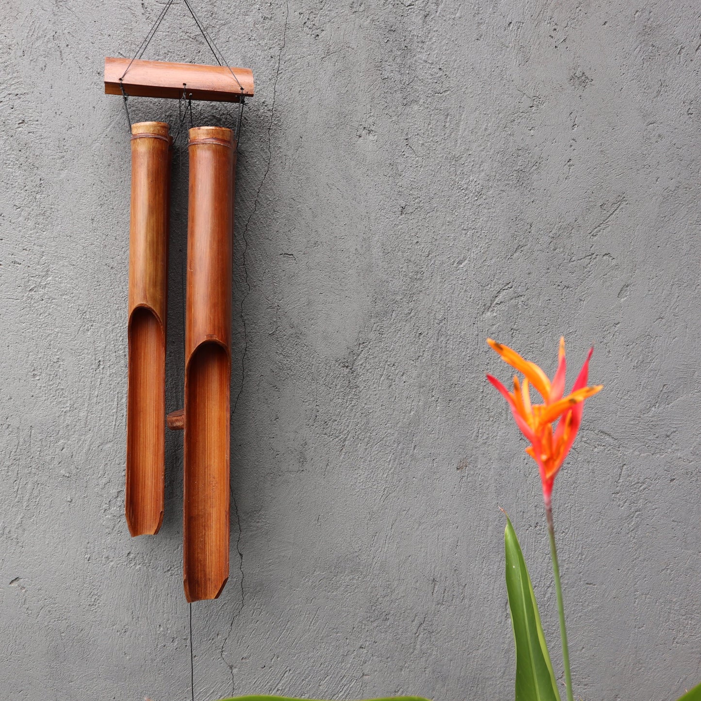 Bamboo Wind Chime - 4 Large Tubes - Natural - 105 cm with four long brown tubes suspended from a rectangular top bar by Quintessential Holistic Health Ltd
