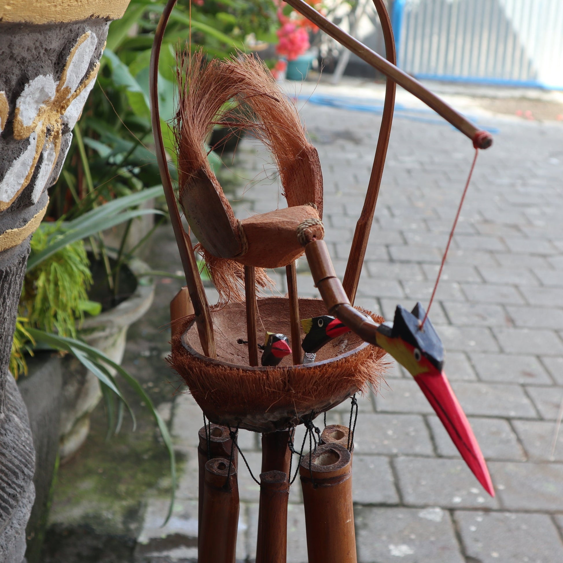Handcrafted Bamboo Wind Chime - Natural - Mother and Chicks in close view with two long-beaked birds above hanging tubes by Quintessential Holistic Health Ltd