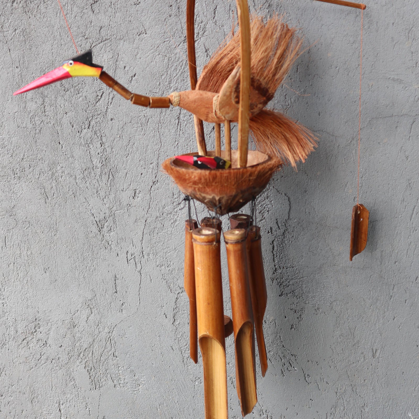 Handcrafted Bamboo Wind Chime - Natural - Mother and Chicks with a long-beaked bird and small chick above four brown tubes by Quintessential Holistic Health Ltd