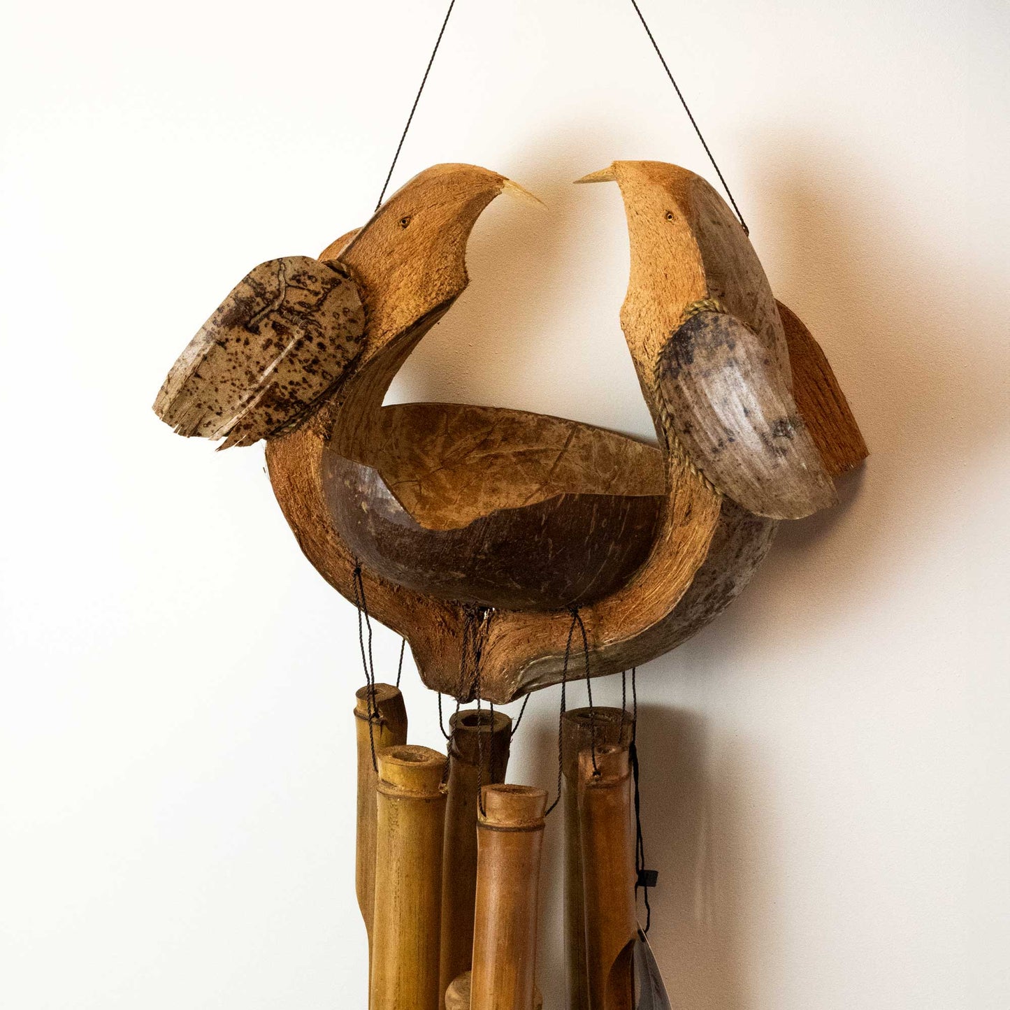 Handcrafted Bamboo Wind Chime - Natural - Love Birds with two rustic carved birds above four hanging brown tubes by Quintessential Holistic Health Ltd
