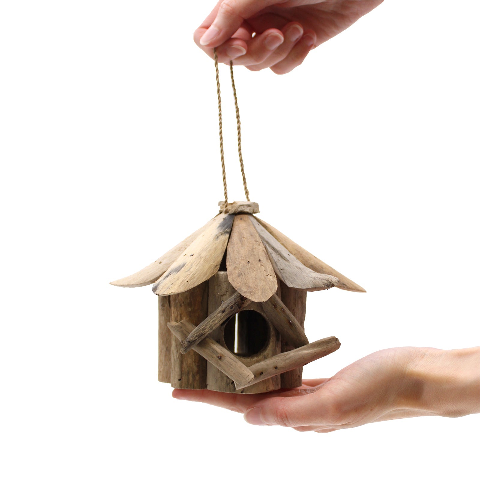 Handmade Recycled Driftwood Bird Box - Small, held by its hanging cord with a round entrance and crossed front branches, by Quintessential Holistic Health Ltd