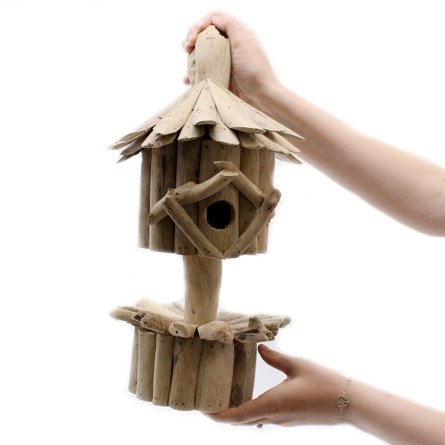 Handmade Recycled Driftwood Bird Box on a Stand with a branch-framed round entrance and raised circular base by Quintessential Holistic Health Ltd
