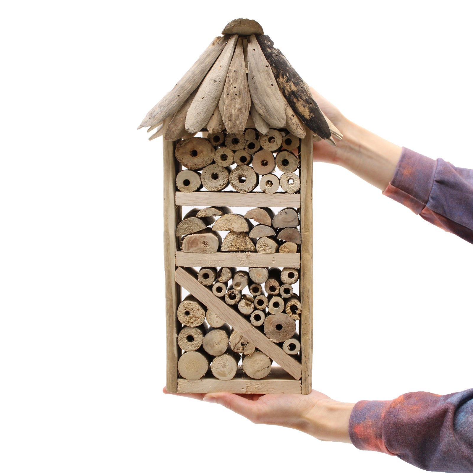 Handmade Recycled Driftwood Bee and Insect Tall House, held between two hands with divided nesting compartments visible, by Quintessential Holistic Health Ltd