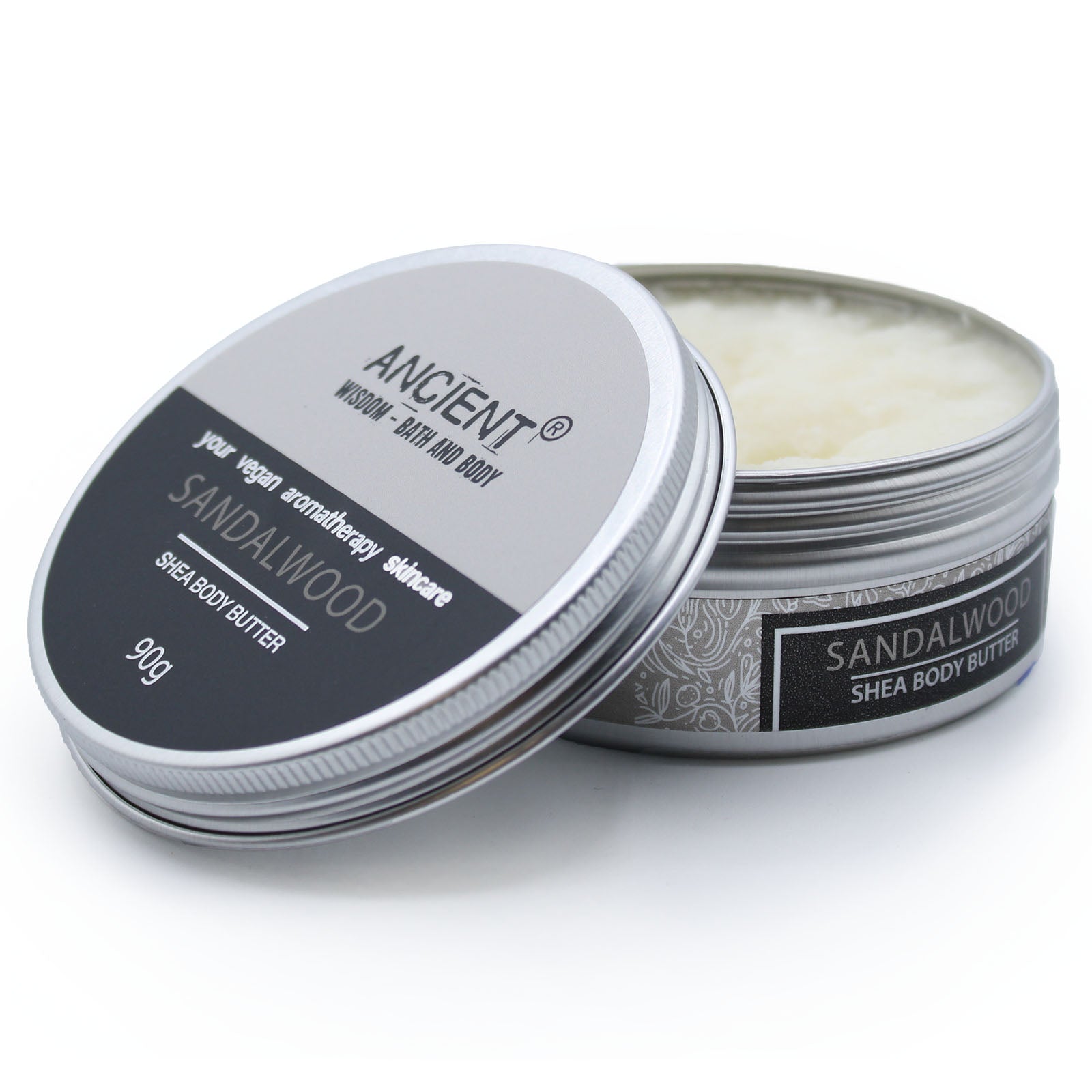 Sandalwood Vegan-Friendly Shea Body Butter 90g in an open round tin with the labelled lid leaning against it by Quintessential Holistic Health Ltd