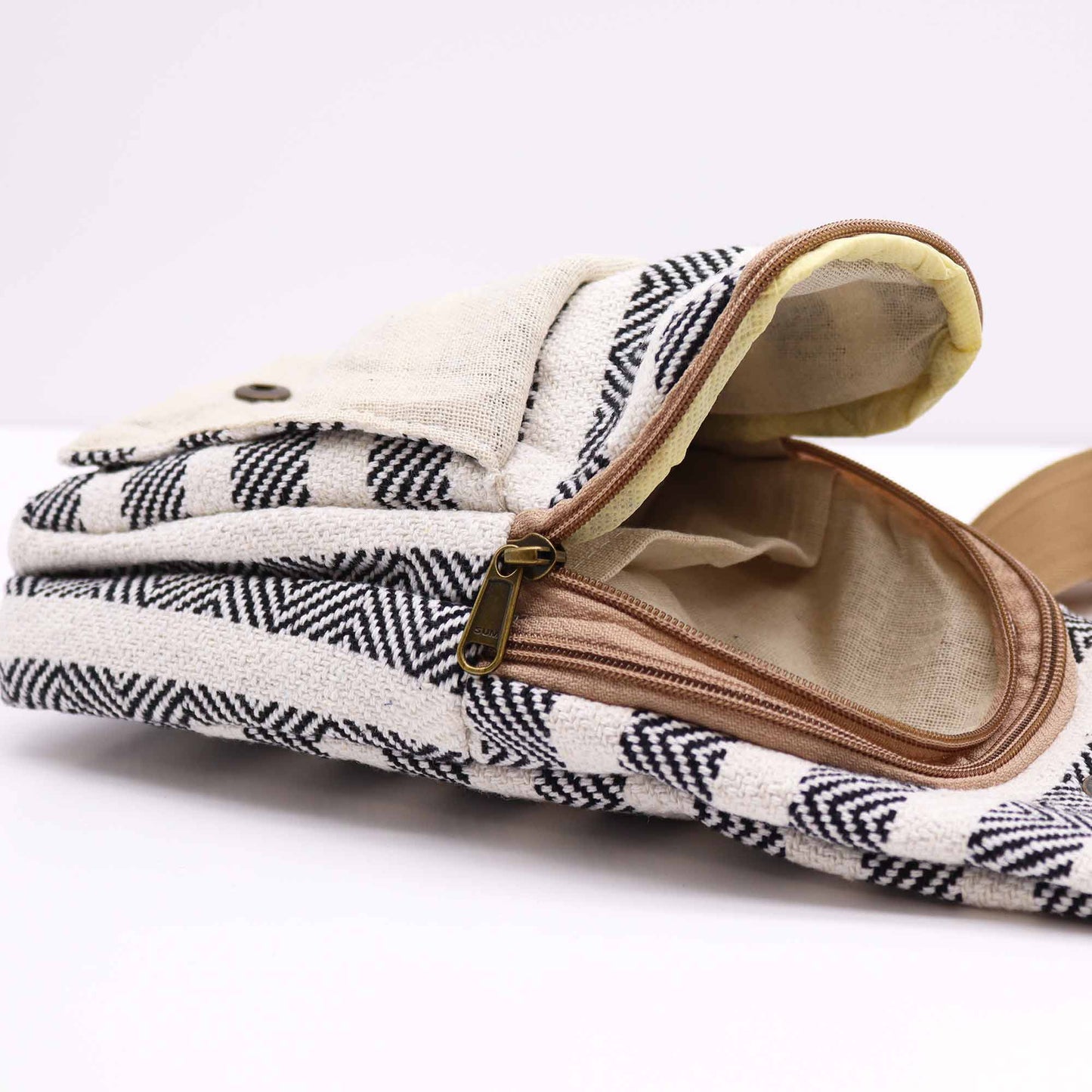 Striped Spacious and Stylish Natural Cotton Cross-Body Bag - Black and White product packaging on clean background from Quintessential Holistic Health Ltd