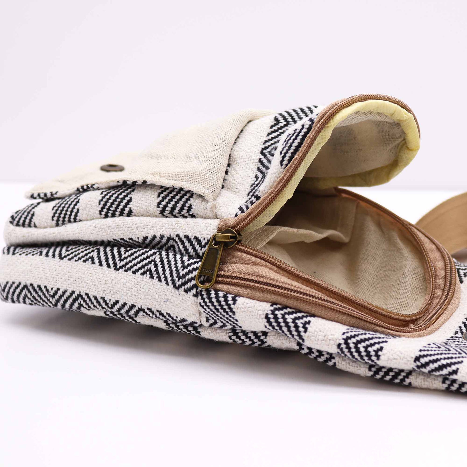 Striped Spacious and Stylish Natural Cotton Cross-Body Bag - Black and White product packaging on clean background from Quintessential Holistic Health Ltd