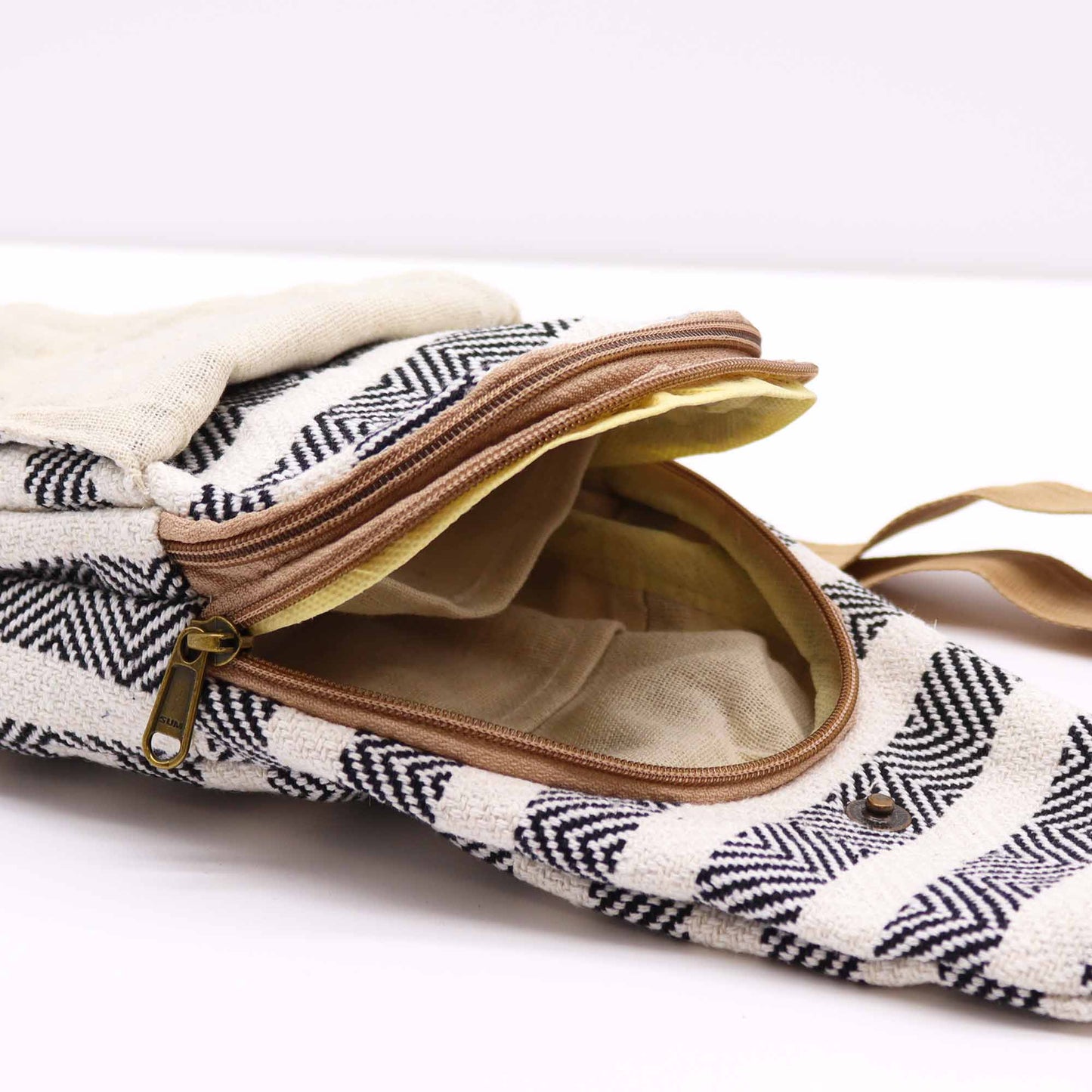 Striped Spacious and Stylish Natural Cotton Cross-Body Bag - Black and White product packaging on clean background from Quintessential Holistic Health Ltd