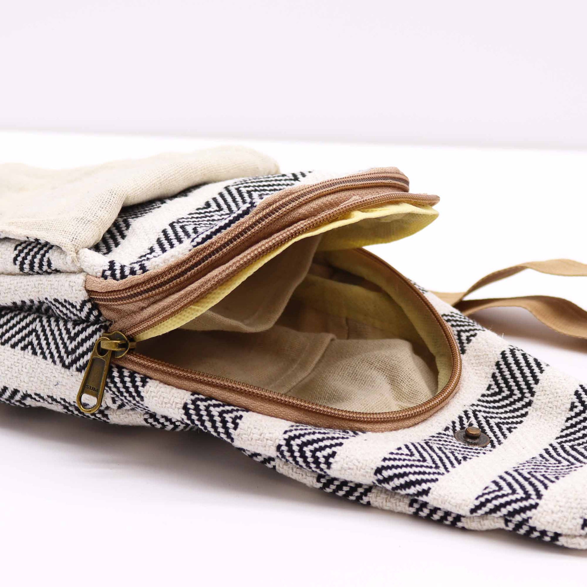 Striped Spacious and Stylish Natural Cotton Cross-Body Bag - Black and White product packaging on clean background from Quintessential Holistic Health Ltd