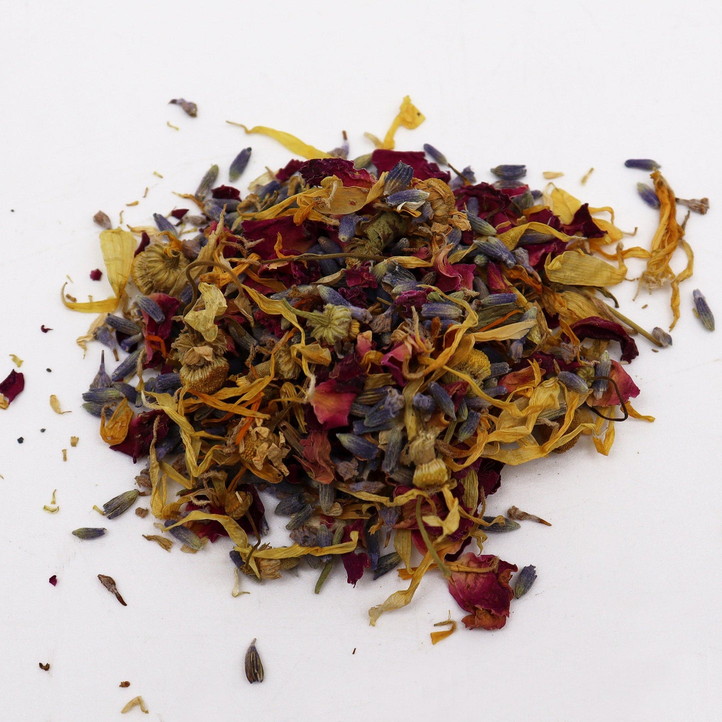 Natural Floral Bath Soak - 140g, close-up mound of mixed yellow, purple and red dried petals and flower pieces, by Quintessential Holistic Health Ltd
