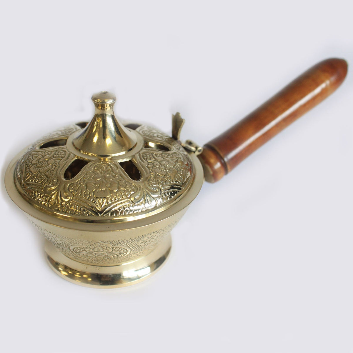 Small Ornate Brass Incense Burner with Handle featuring a pierced domed lid, engraved bowl and brown wooden grip by Quintessential Holistic Health Ltd