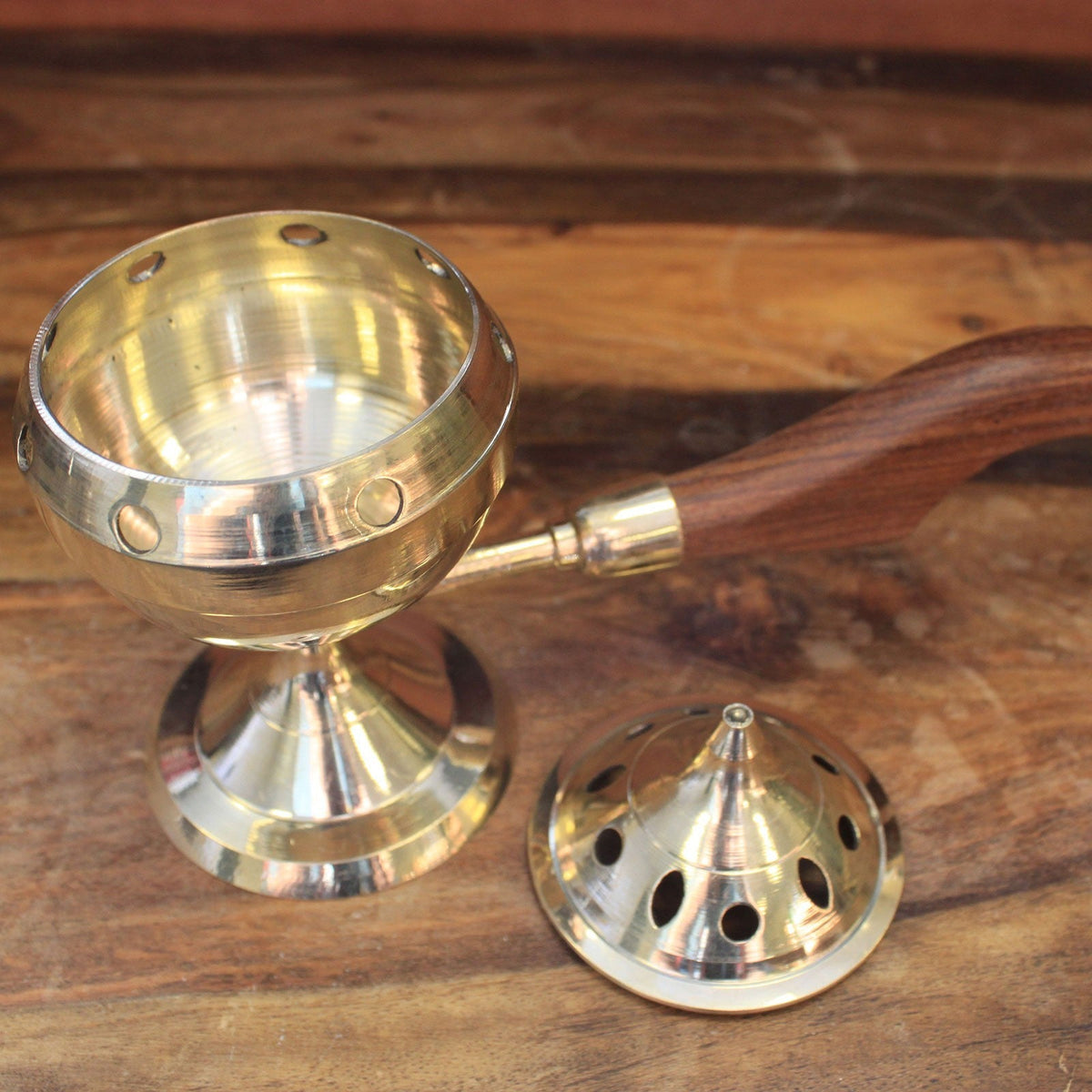 Small Plain Brass Incense Burner with Handle, shown open with its reflective bowl and pointed perforated lid beside it by Quintessential Holistic Health Ltd