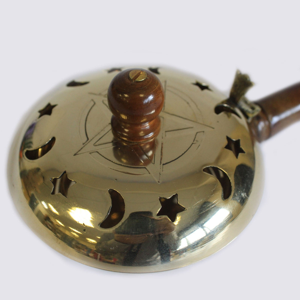 Large Pentagram Brass Incense Burner with Handle, showing star and crescent cutouts around the raised wooden knob, by Quintessential Holistic Health Ltd