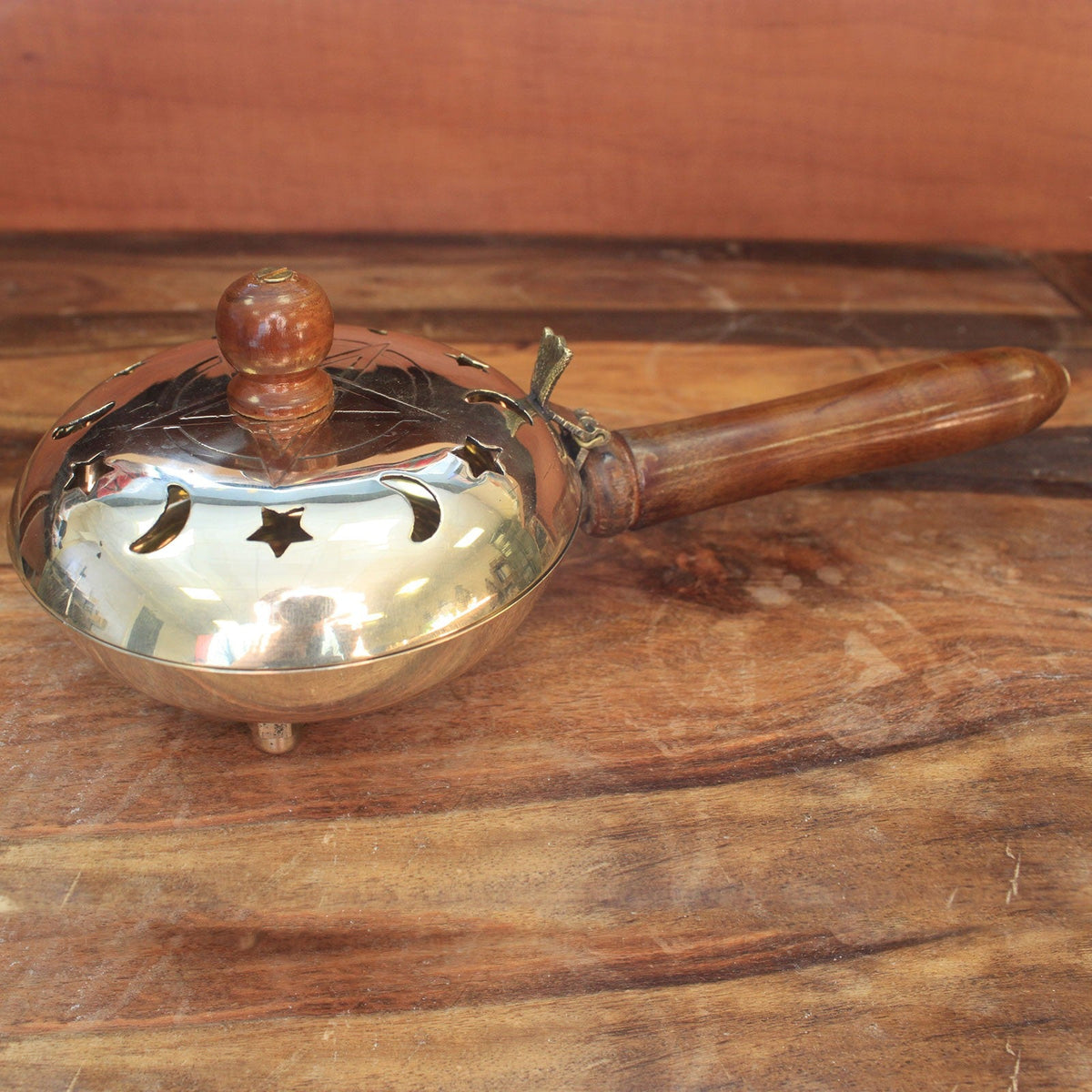 Large Pentagram Brass Incense Burner with Handle, with a reflective bowl, pierced domed lid and dark wooden fittings, by Quintessential Holistic Health Ltd