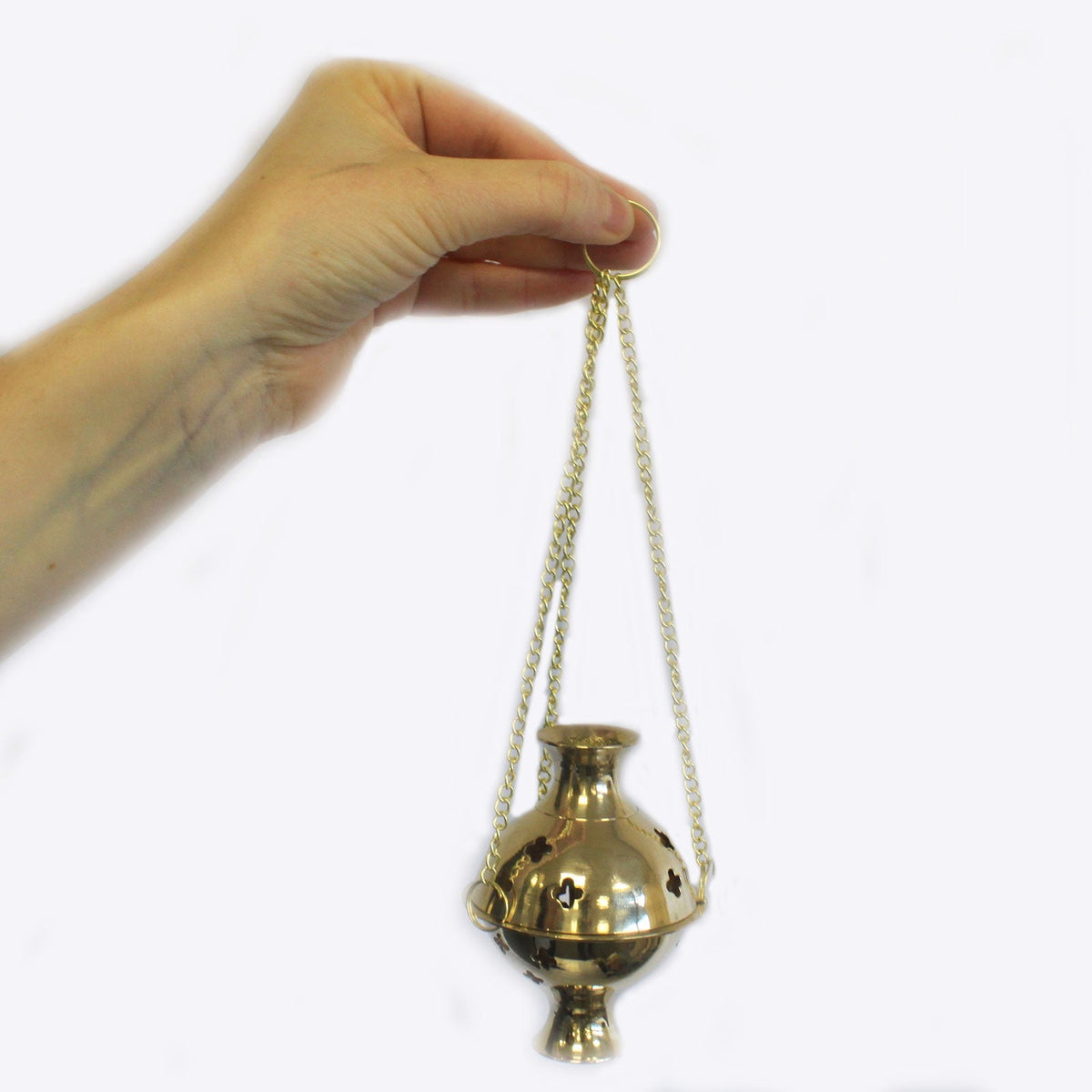 Brass Hanging Incense Burner - Plain suspended from three gold-tone chains held in one hand by Quintessential Holistic Health Ltd