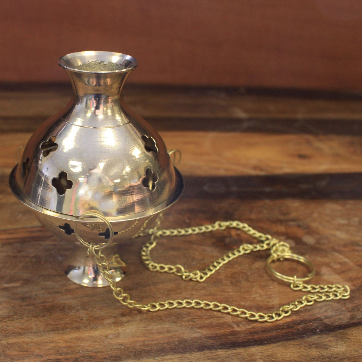 Brass Hanging Incense Burner - Plain with a rounded pierced body, narrow pedestal base and trailing gold-tone chain by Quintessential Holistic Health Ltd