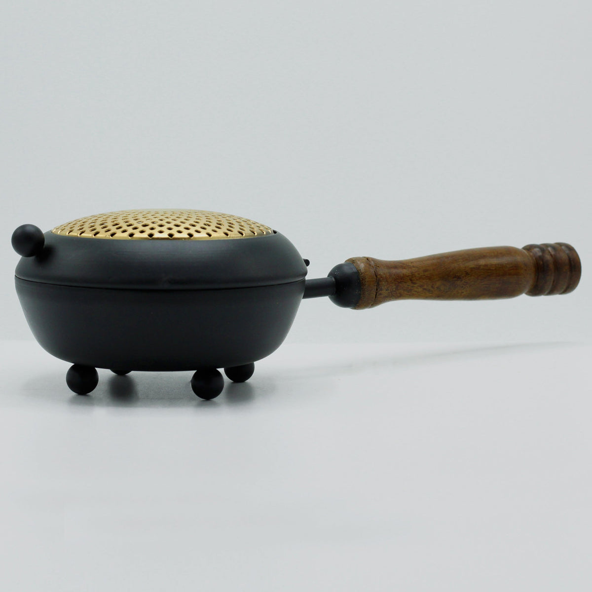 Cast Iron Incense Burner with Gold Detail - Large, with perforated gold lid, three feet and wooden side grip by Quintessential Holistic Health Ltd